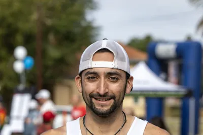 Veteran athlete holding a race trophy